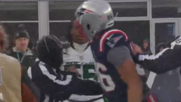 Patriots’ Pharaoh Brown battles to the sideline.
